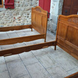 Pair of beds and Art Nouveau bedside in oak, France, circa 1910