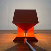 Orange metal table lamp, minimalist, modern mid-century space age, 1960s.