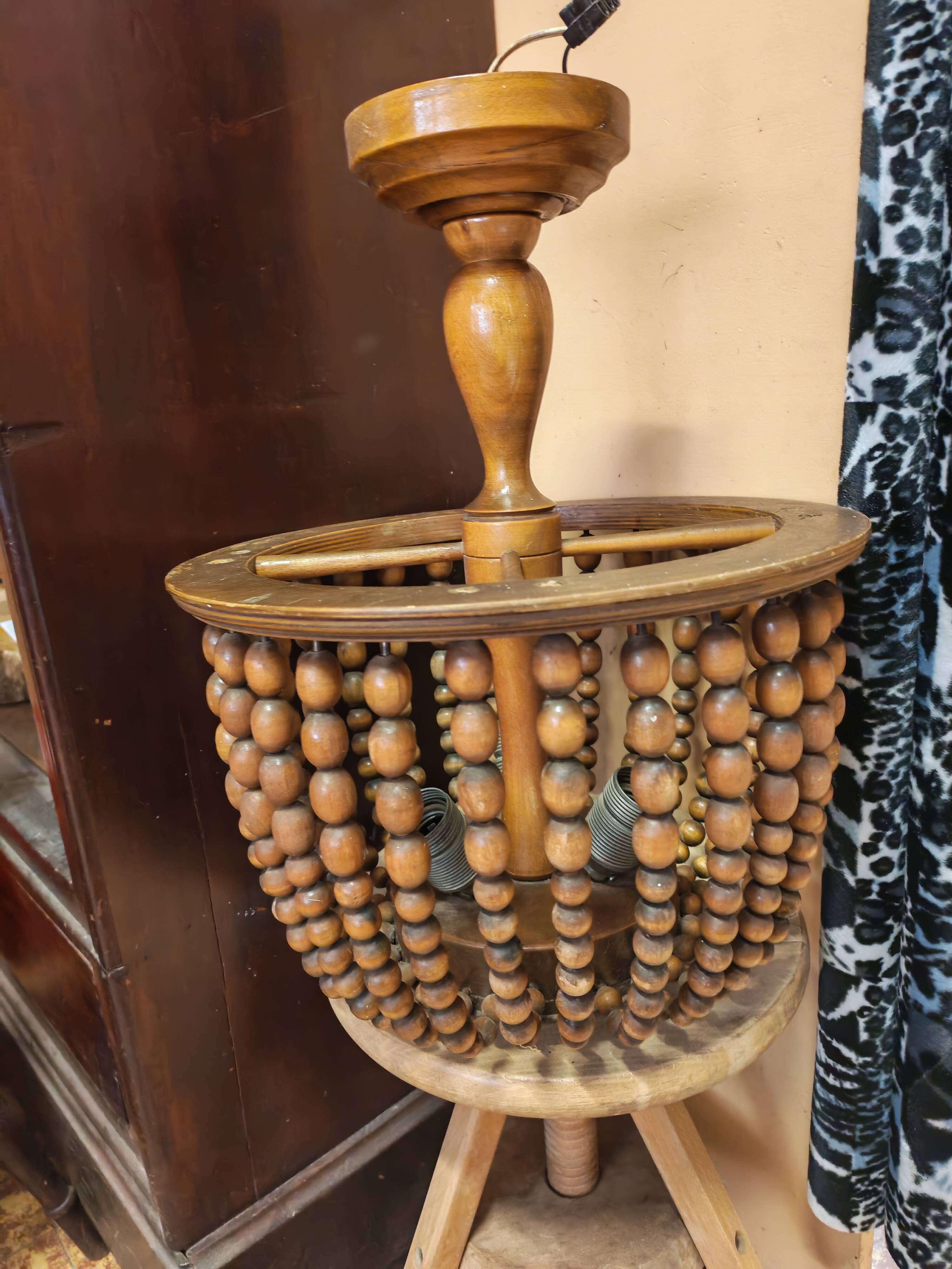 Vintage wooden turned cage chandelier with beads from the 1960s.