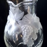 Large water jug with embossed fruit decoration in frosted glass