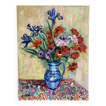 Iris and orange carnations, oil on canvas signed Gisèle Renaut.