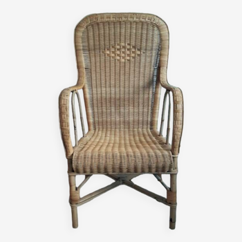 Vintage woven rattan armchair.