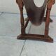 Vintage magazine rack in oak and antique leather