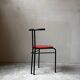Set of 4 vintage black metal chairs with red lacquered seats.