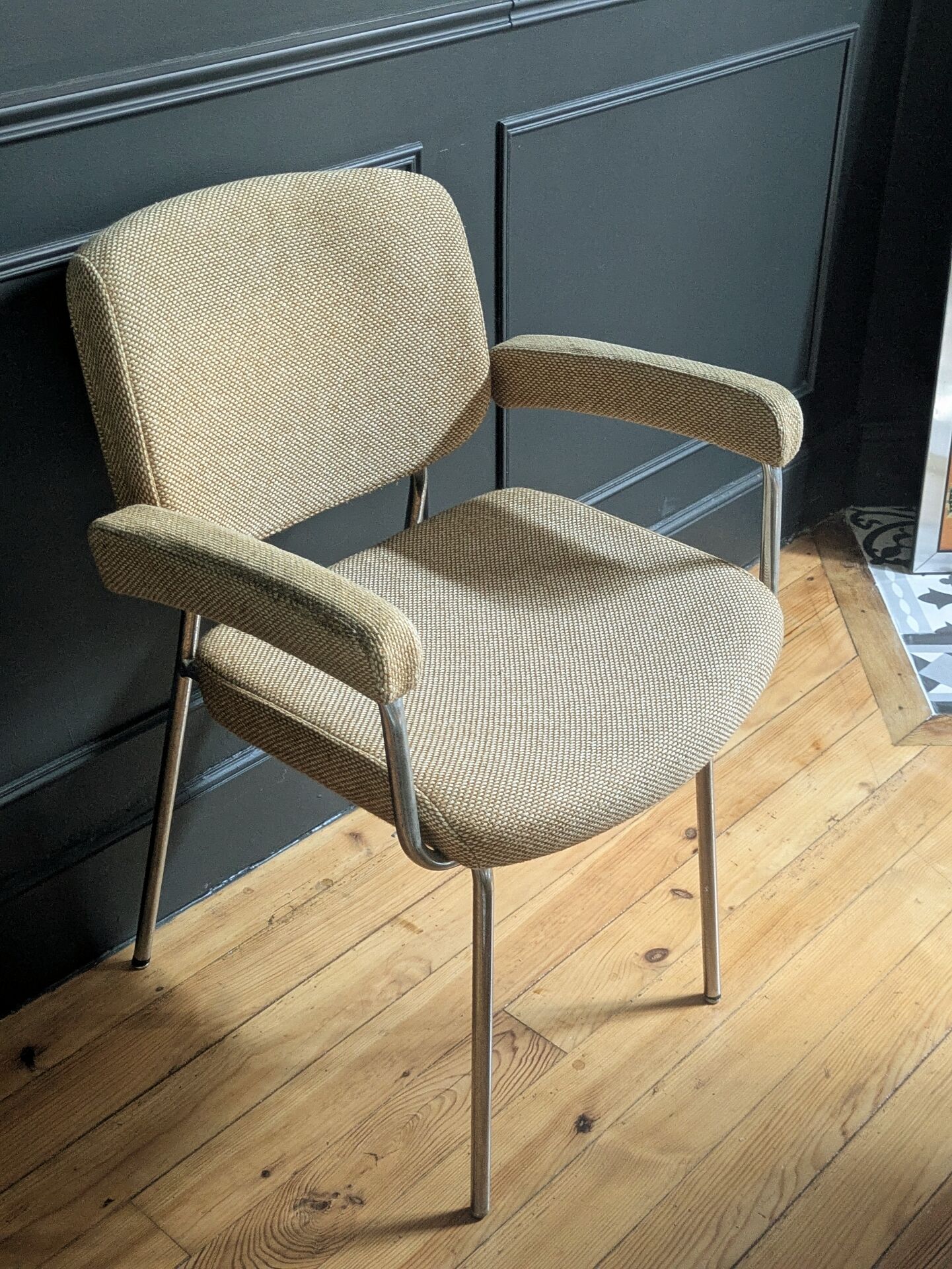 vintage tubular metal chrome office chair with patterned fabric.