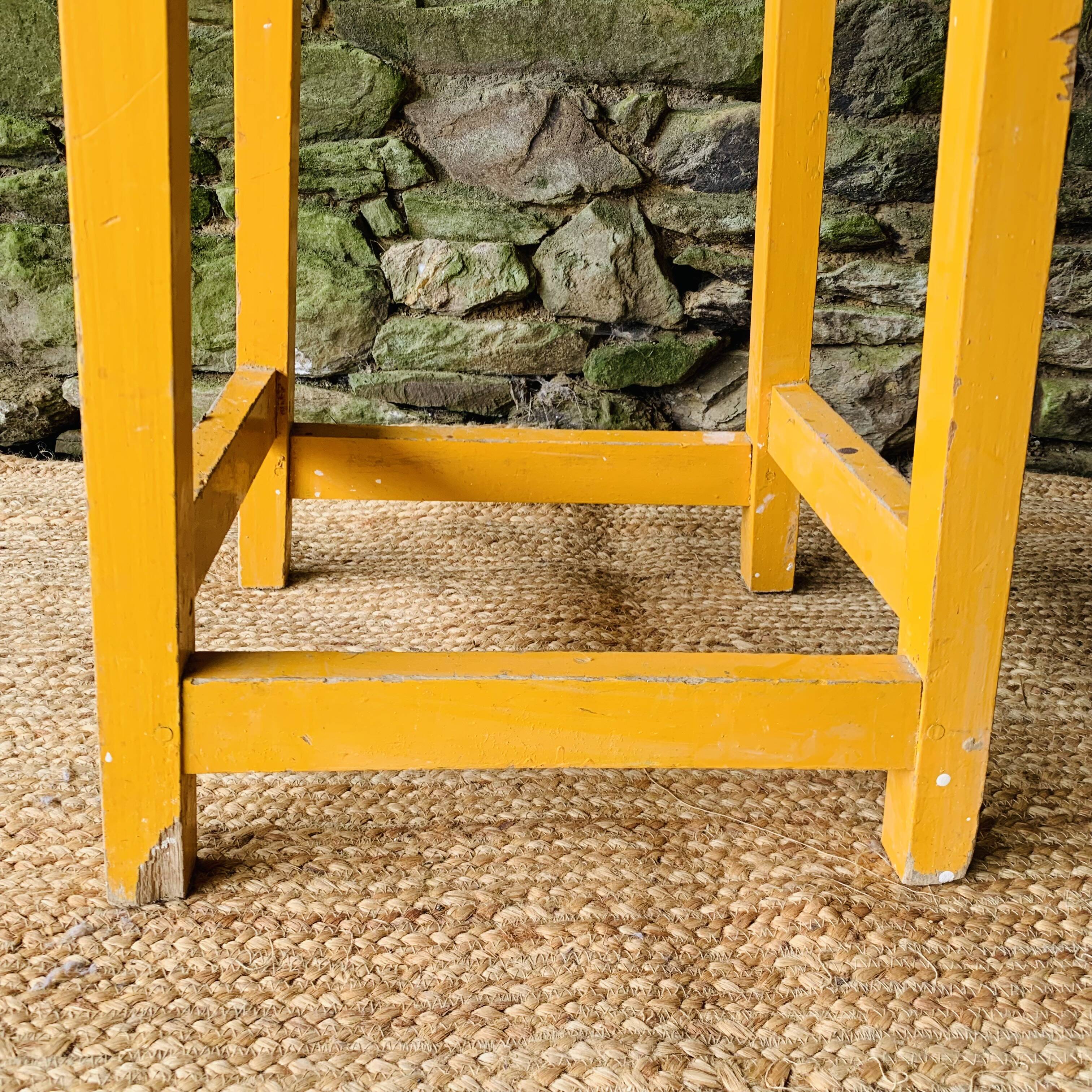 Yellow wooden high stool