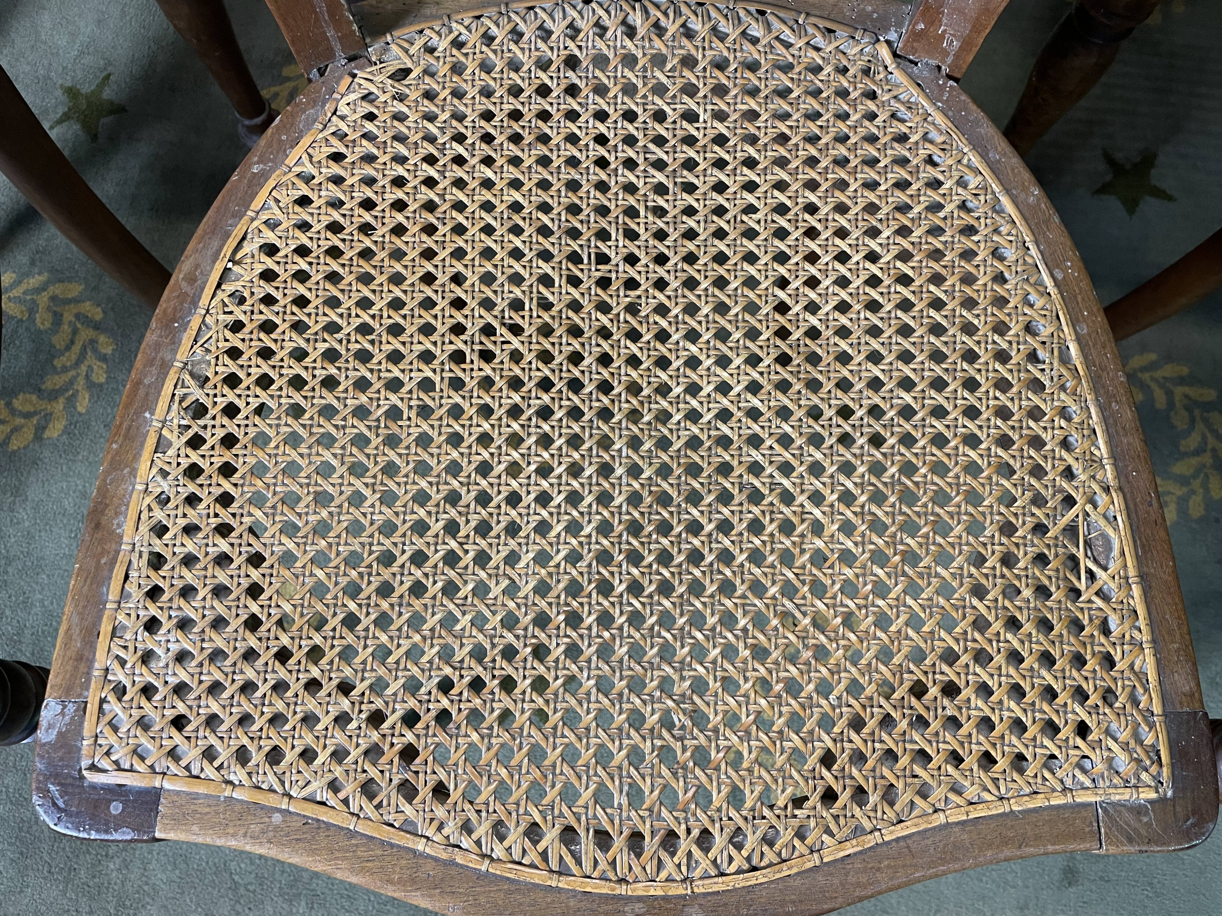 Suite of 12 Louis Philippe period chairs in walnut and canning