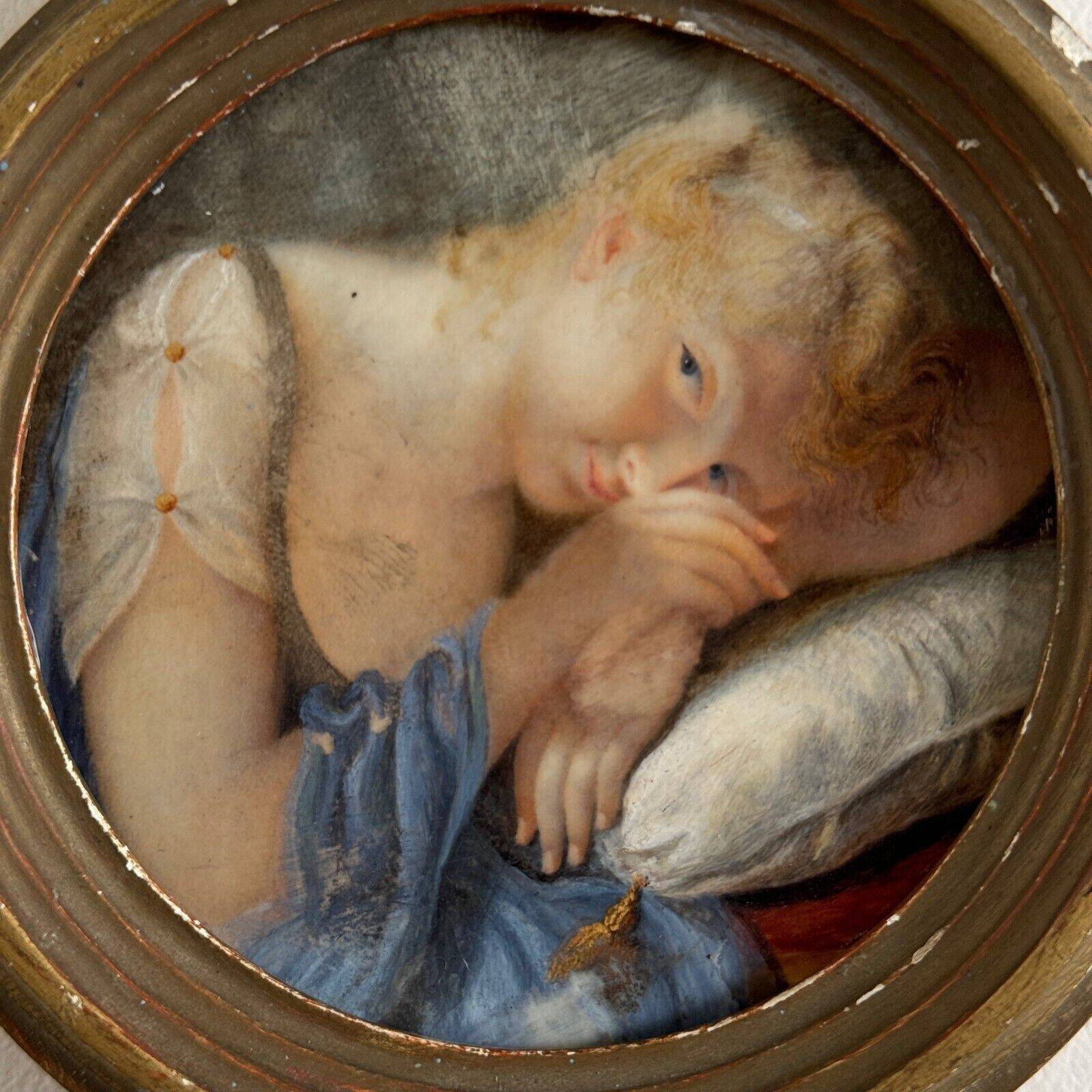 19th century miniature of a young girl with her head resting on a cushion