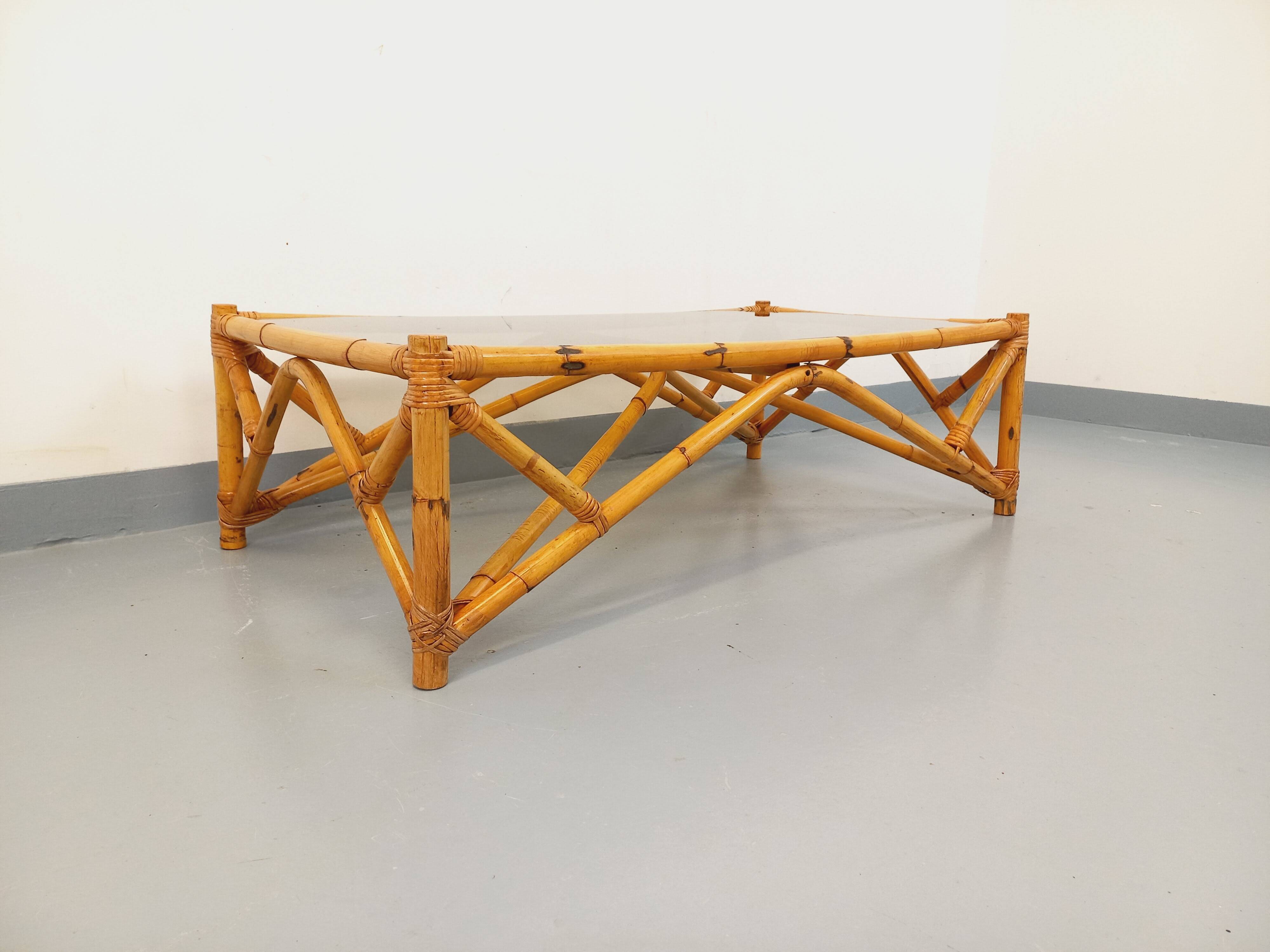Vintage rectangular coffee table in rattan and smoked glass from the 1970s.