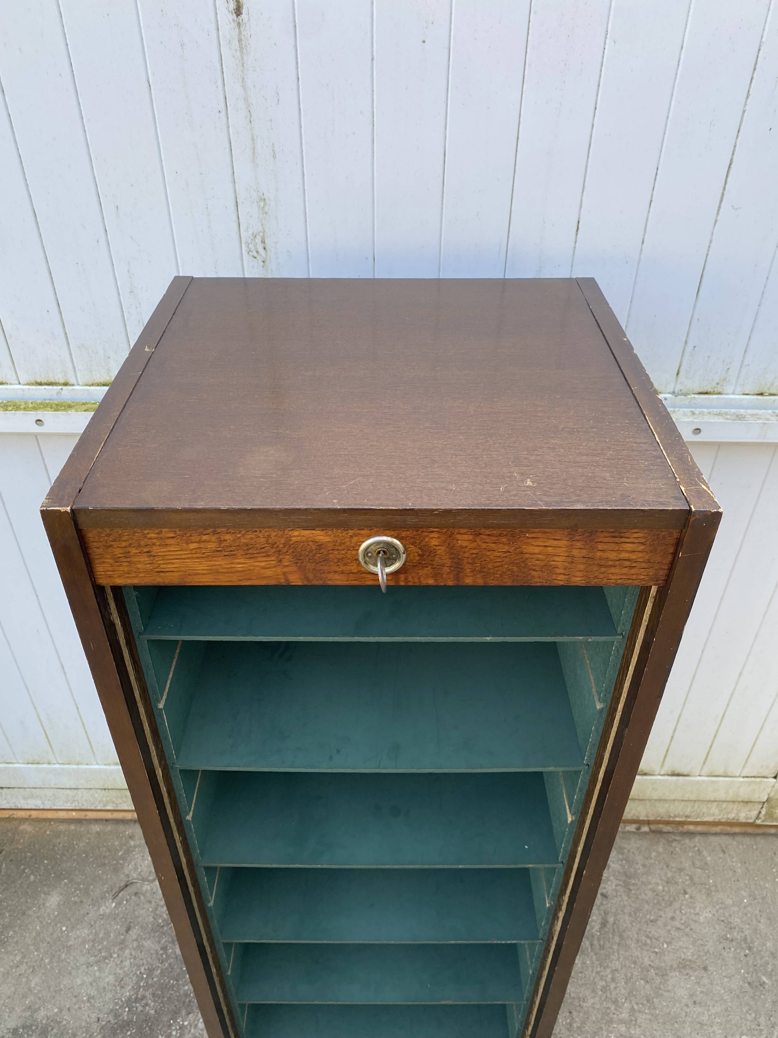1970 oak office storage cabinet with curtains.
