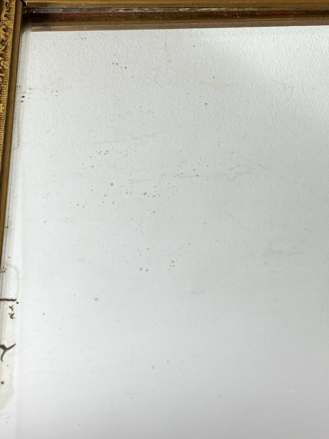 Antique mirror in carved gilded wood