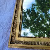 Old mirror in gilded wood