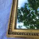 Old mirror in gilded wood