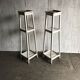Two white vintage mid-20th century wooden plant stands, 3-tier shelves.