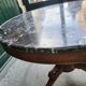 Round pedestal table with marble top and mahogany tripod from the 19th century