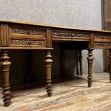 Renaissance style center desk with side pulls in carved walnut