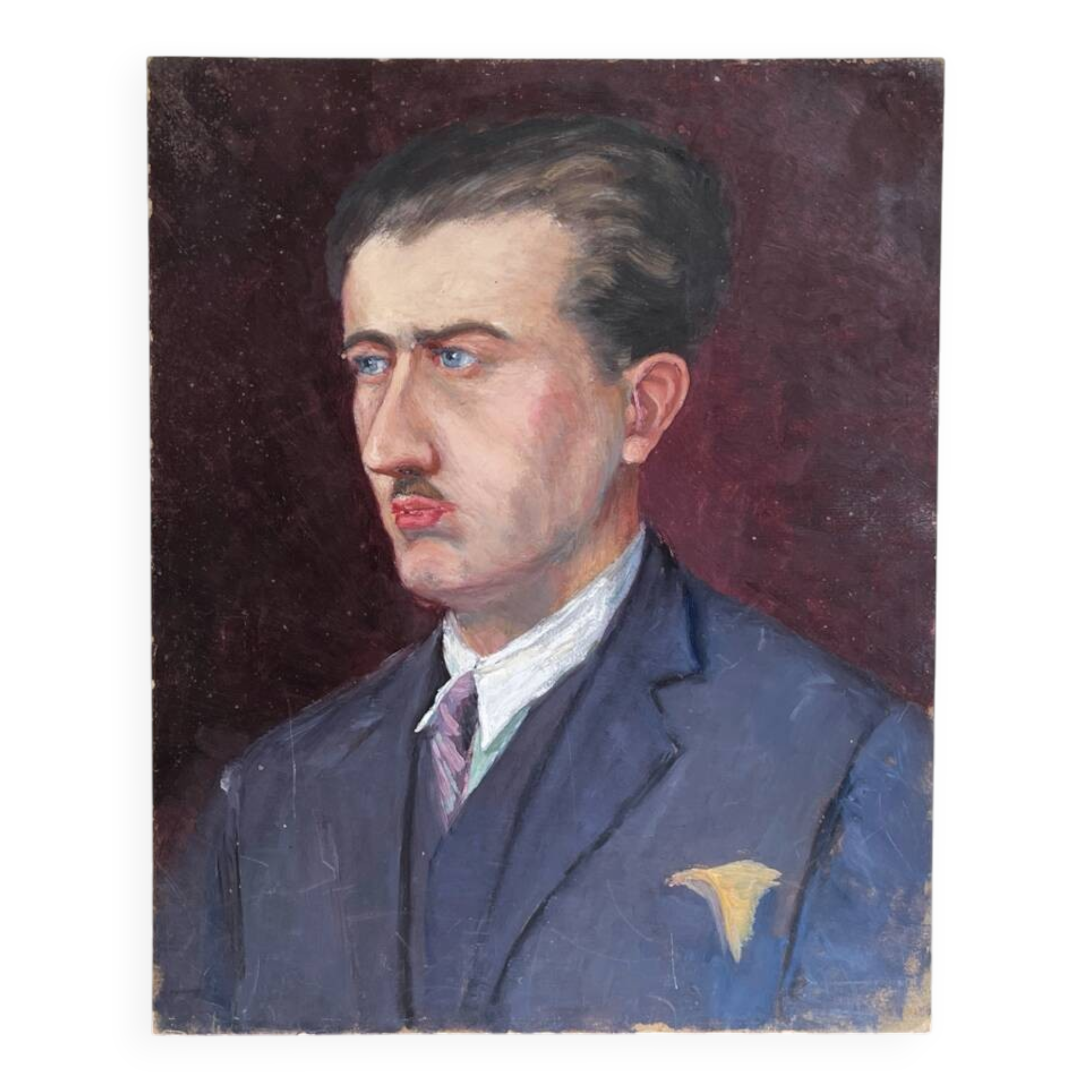 Old oil painting on cardboard portrait of a man in a blue suit