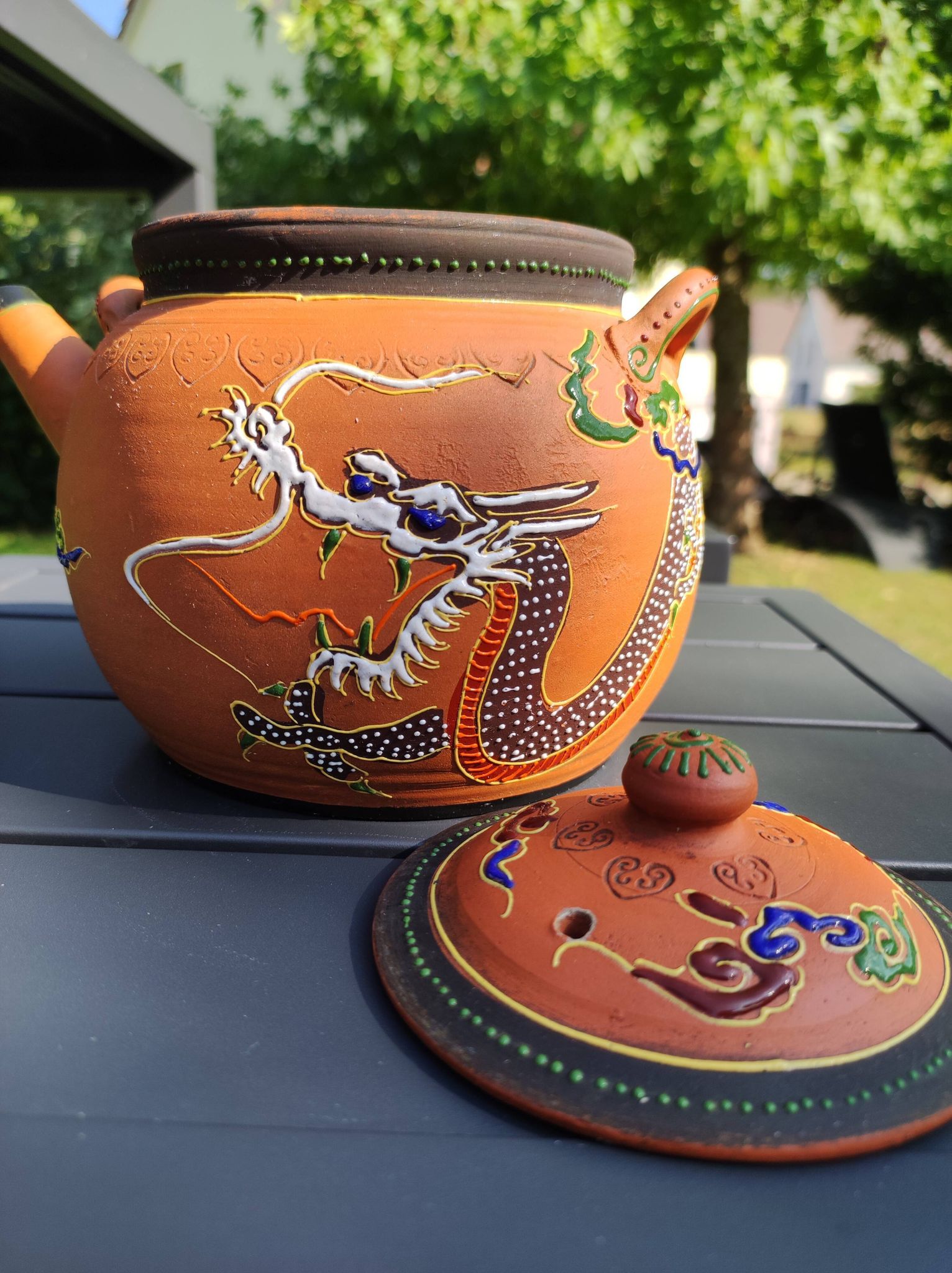 Antique decorative Japanese teapot in terracotta orange tones, with multico enamelled dragon decoration