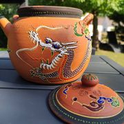 Antique decorative Japanese teapot in terracotta orange tones, with multico enamelled dragon decoration