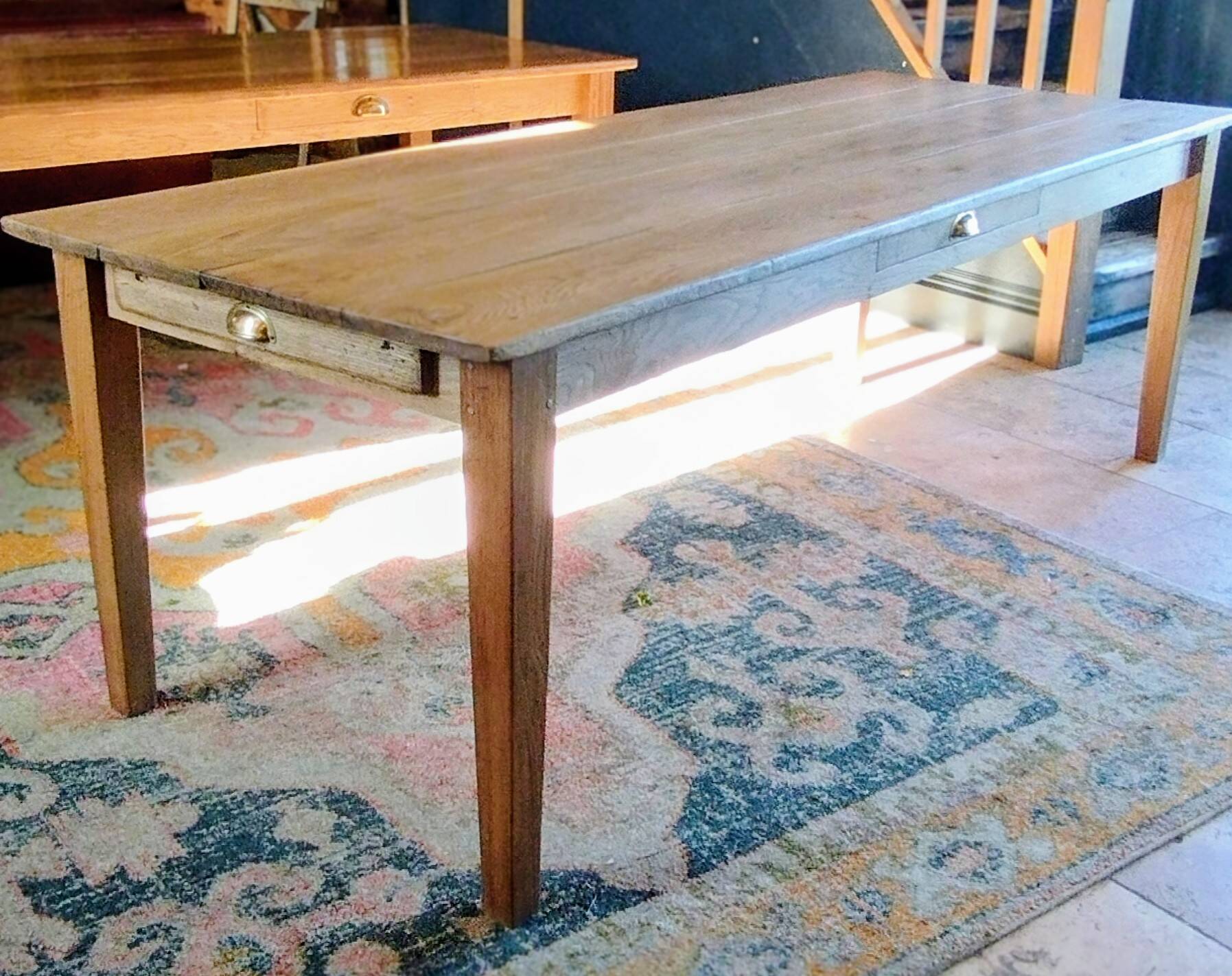 Solid oak farmhouse table with central drawer and extension