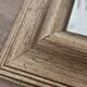 Beveled mirror under gold frame
