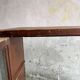 Dark-stained wood and glass vintage display cabinet — early 20th-century wall-mounted showcase