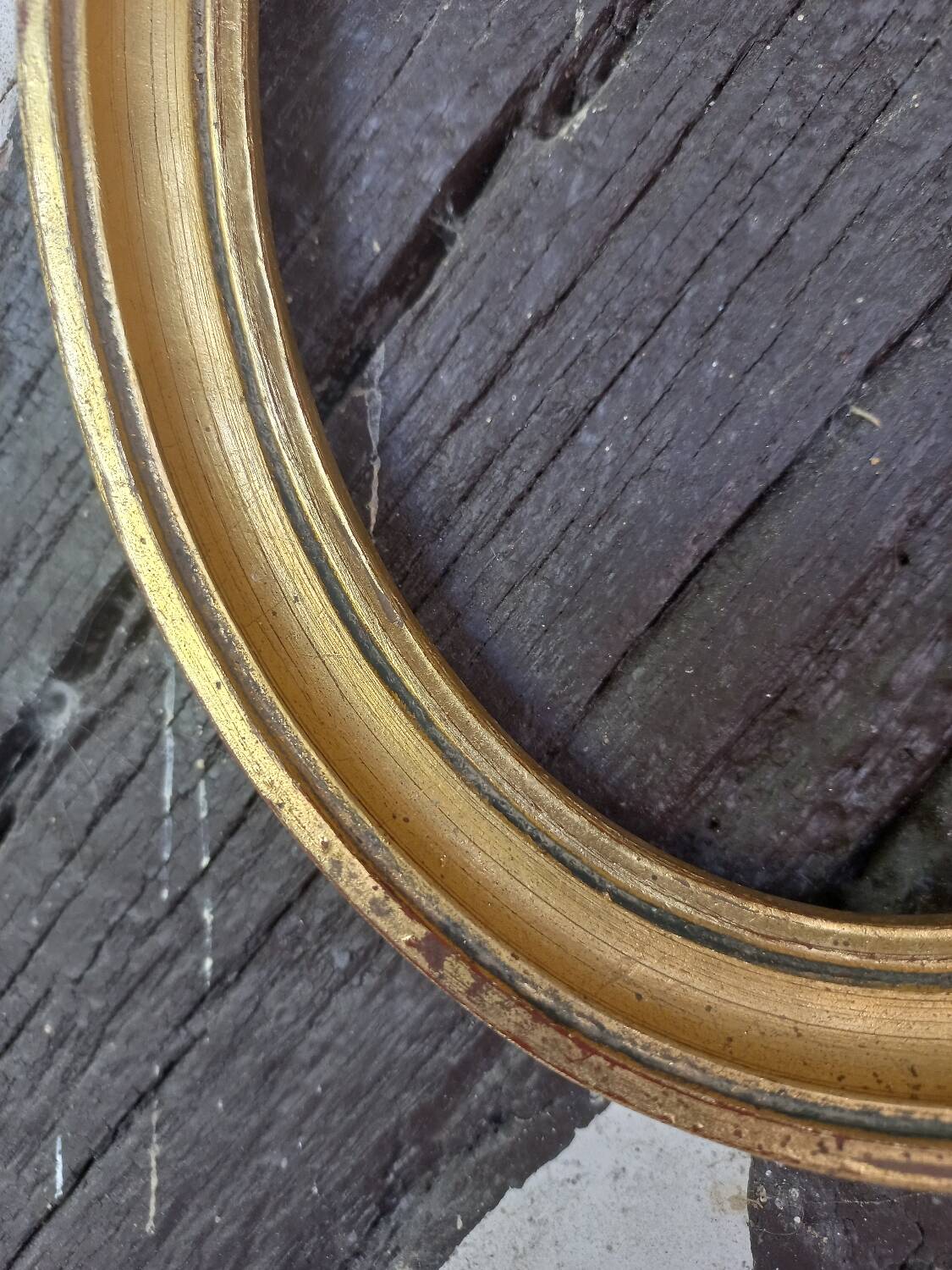Golden oval frame