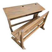 Double school desk and its wooden bench