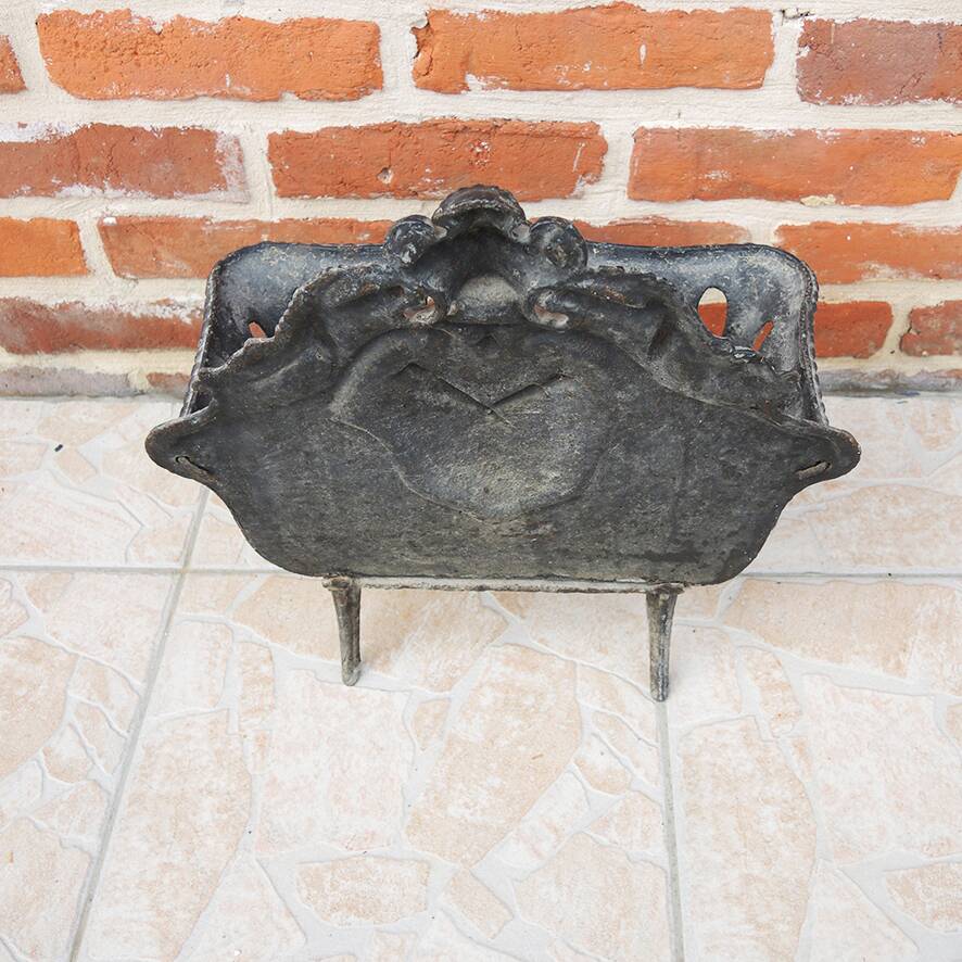 Antique black cast iron log cradle in rococo style