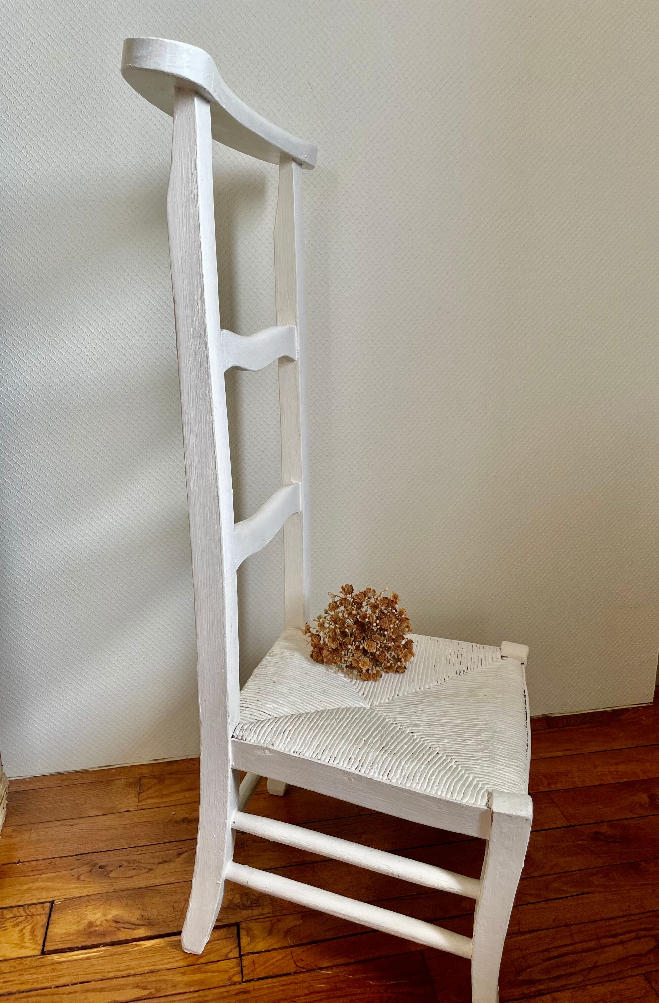 Old white mulched wooden chair