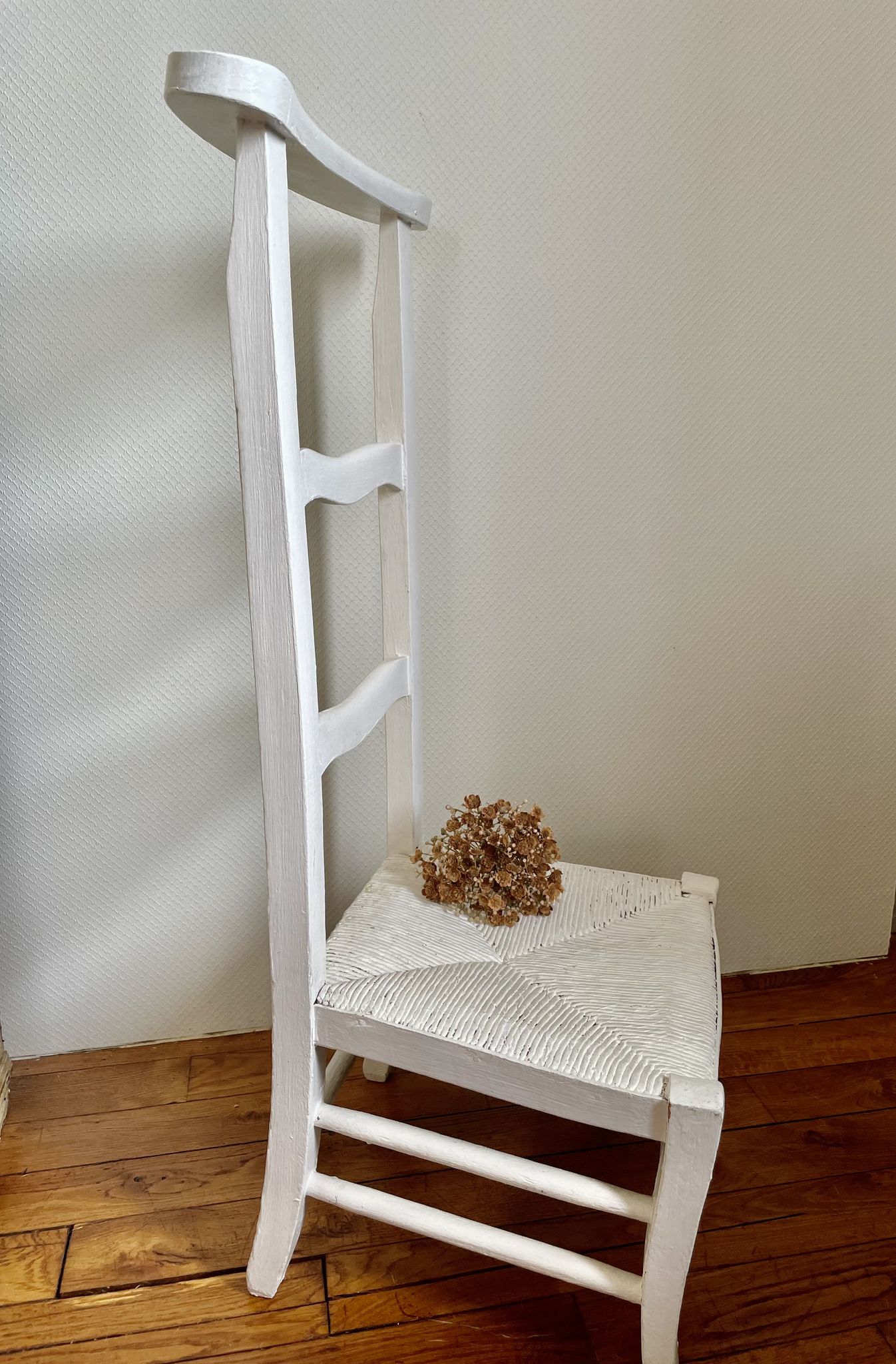 Old white mulched wooden chair