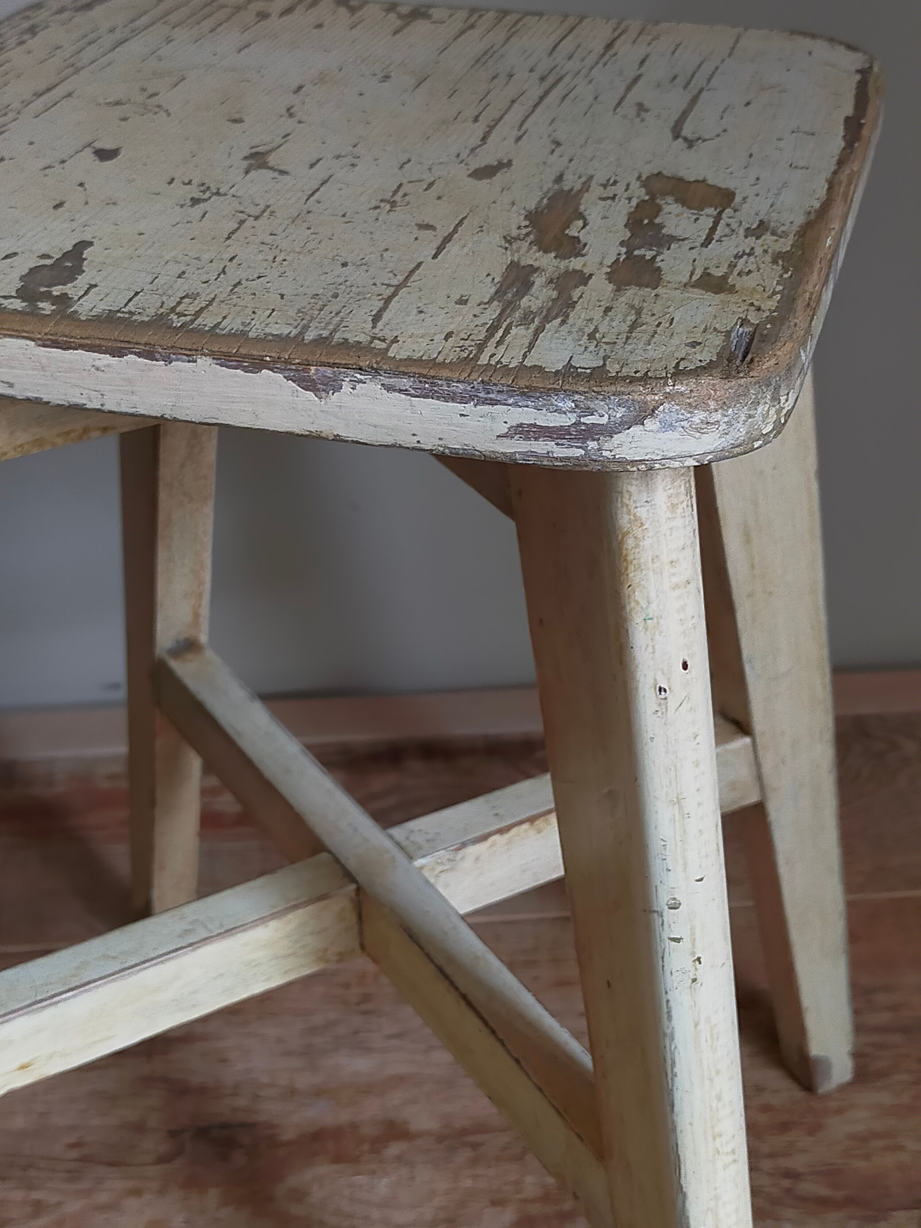 Old workshop stool in patinated solid wood