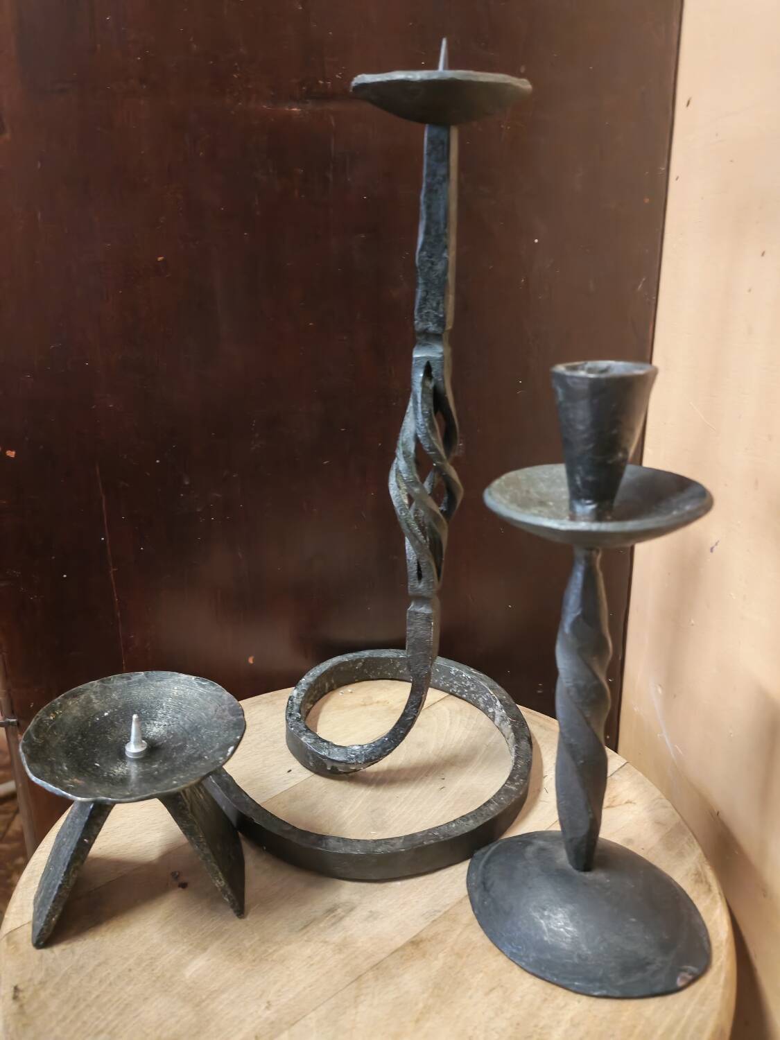 Set of 3 candlesticks and a candle holder in wrought iron.