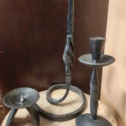 Set of 3 candlesticks and a candle holder in wrought iron.