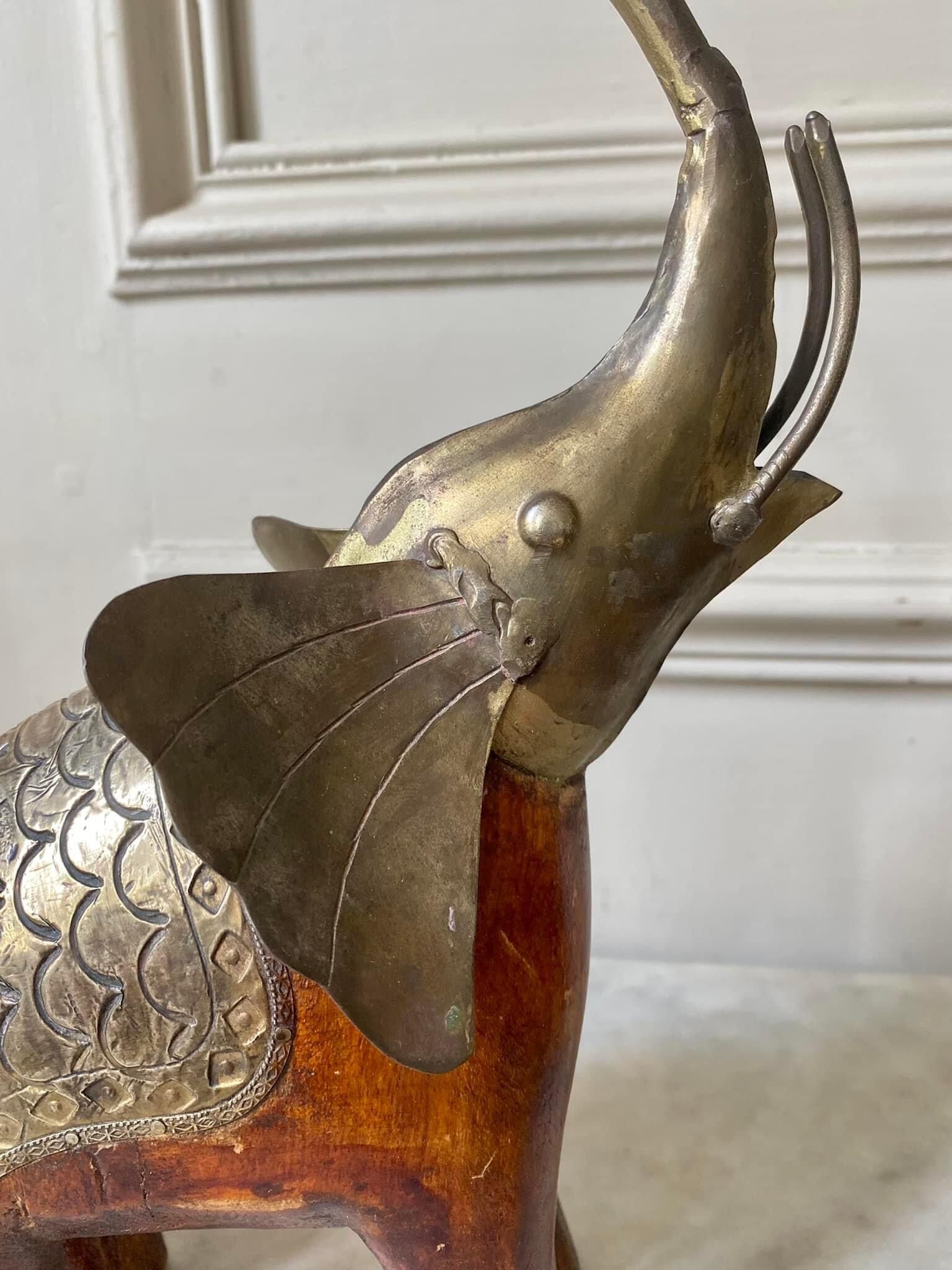 Wooden elephant and brass