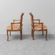 Paire de fauteuils de style parisien en bois avec des accoudoirs en tissu rayé, vintage.