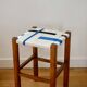 Wooden stool. Vintage stool. woven stool