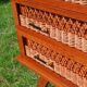 Rattan and wood splayed-leg chest of drawers
