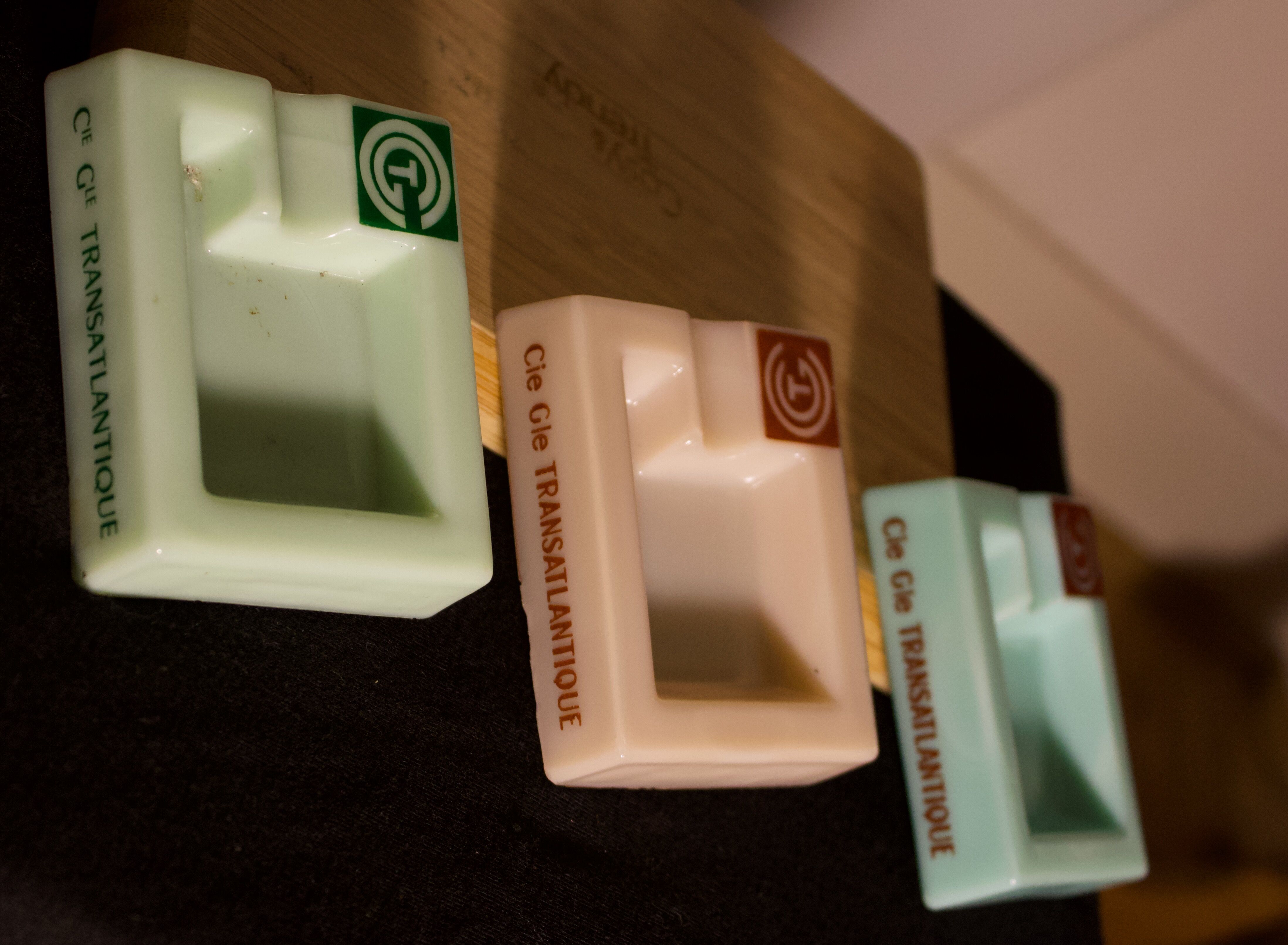 Three opalex ashtrays at the Logo of the Trans-Atlantic General Company - French Line - Model created by Jean Luce for the cruises of the liner Normandy and France