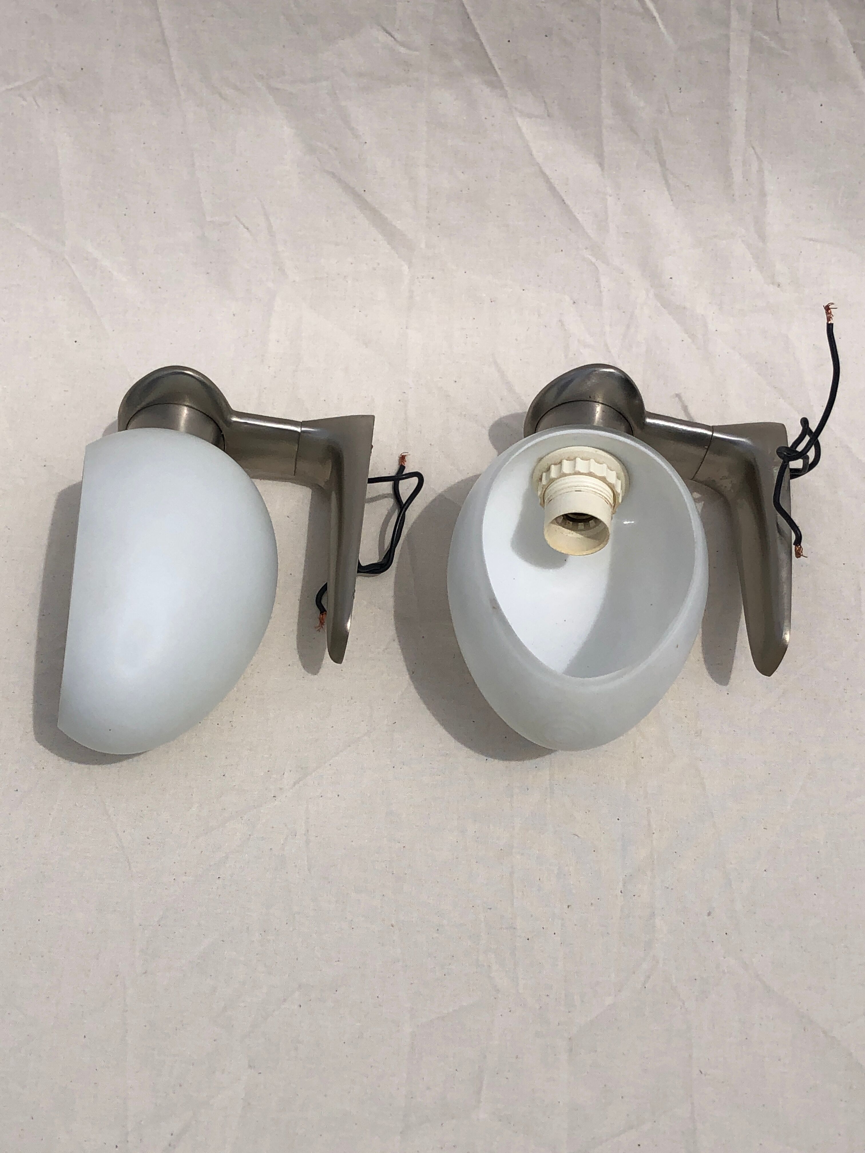 Pair of brushed steel appliques, half-egg opaline, 1970