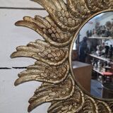 sun mirror with angel wings in golden patinated stucco