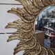 sun mirror with angel wings in golden patinated stucco