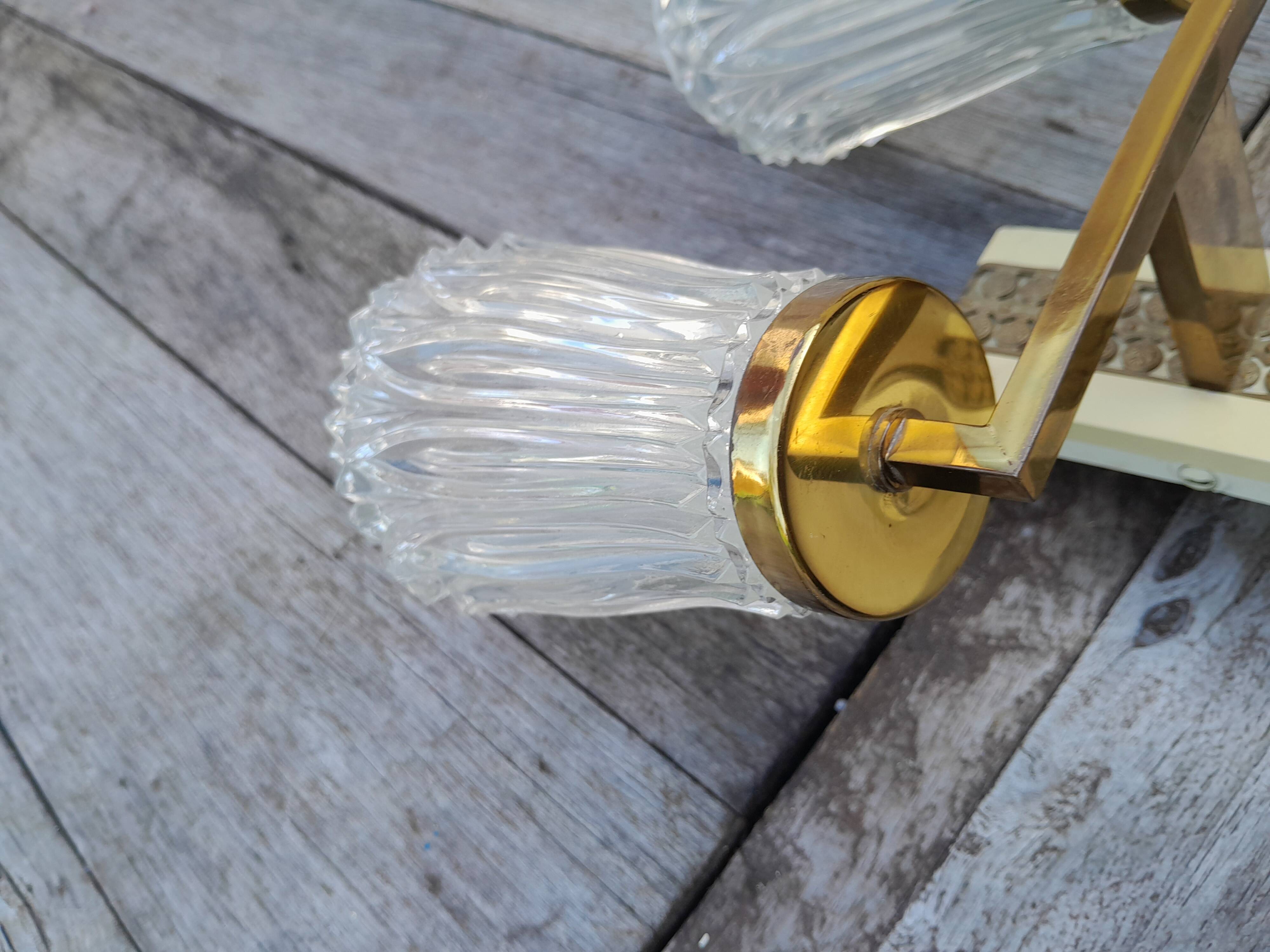 Pair of vintage wall lights from the 50s and 60s in brass glass