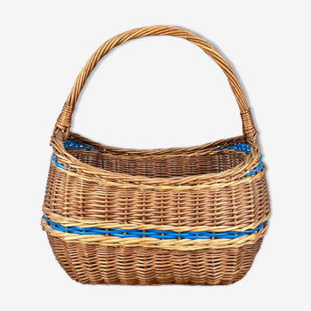 Old wicker basket with handle and blue scoubidou