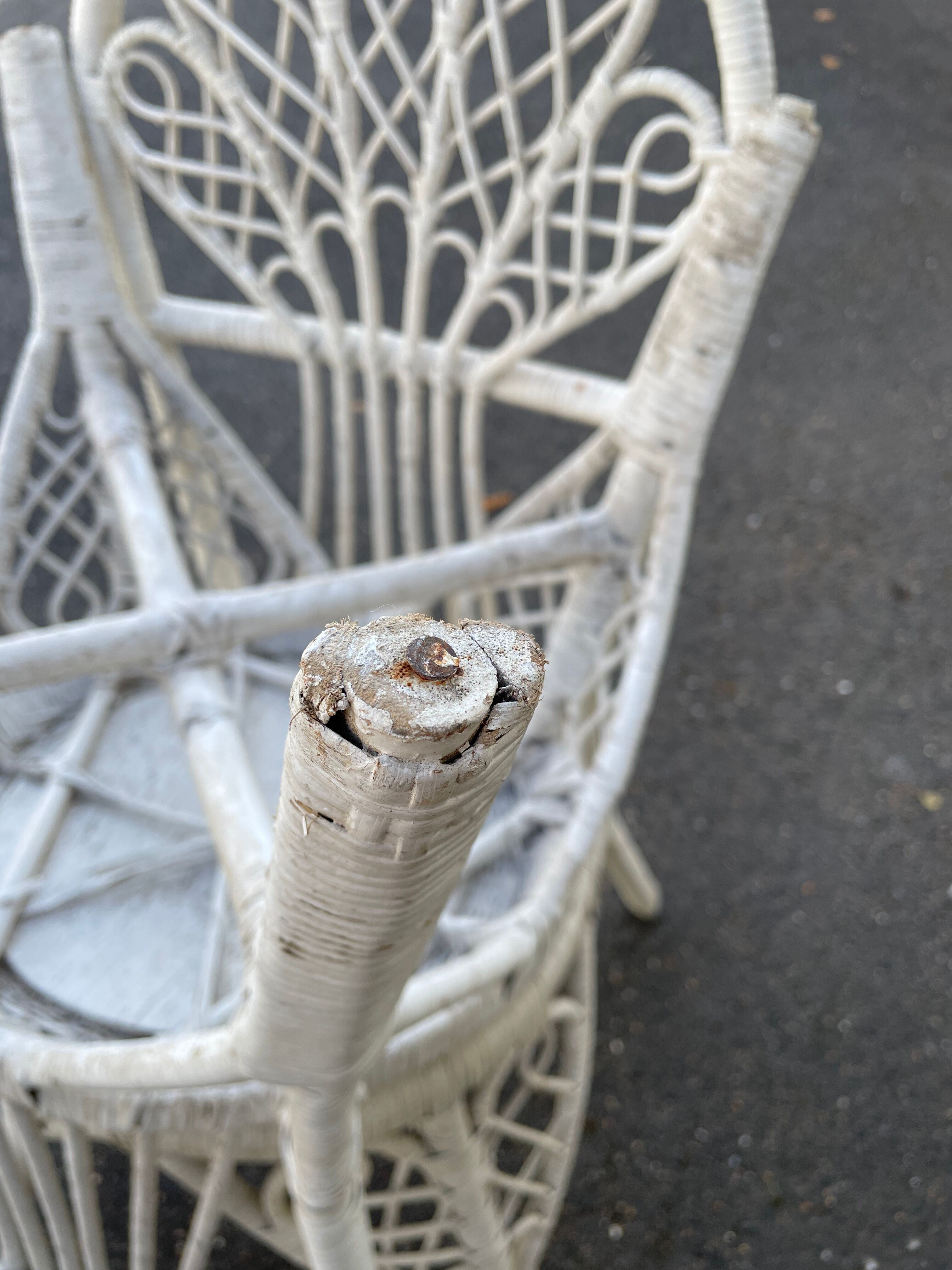 Pair of white peacock rattan chairs, circa 1960