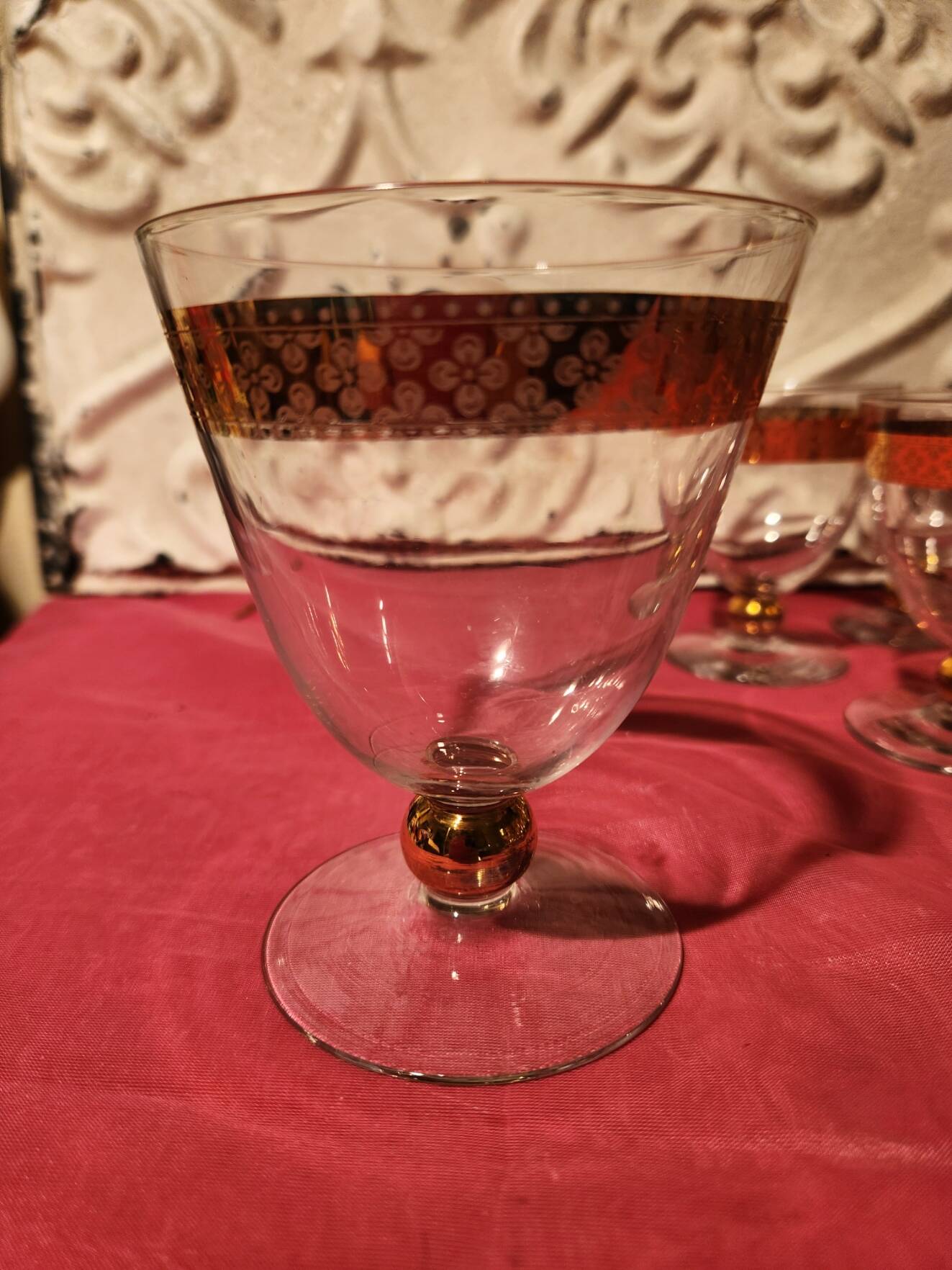 1930s footed glass service with gilding, including champagne flutes.