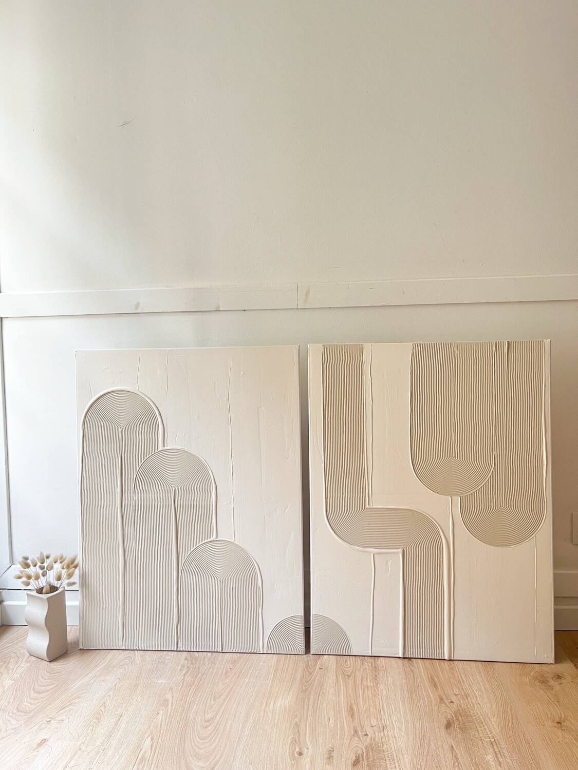 Beige and white relief diptych panels