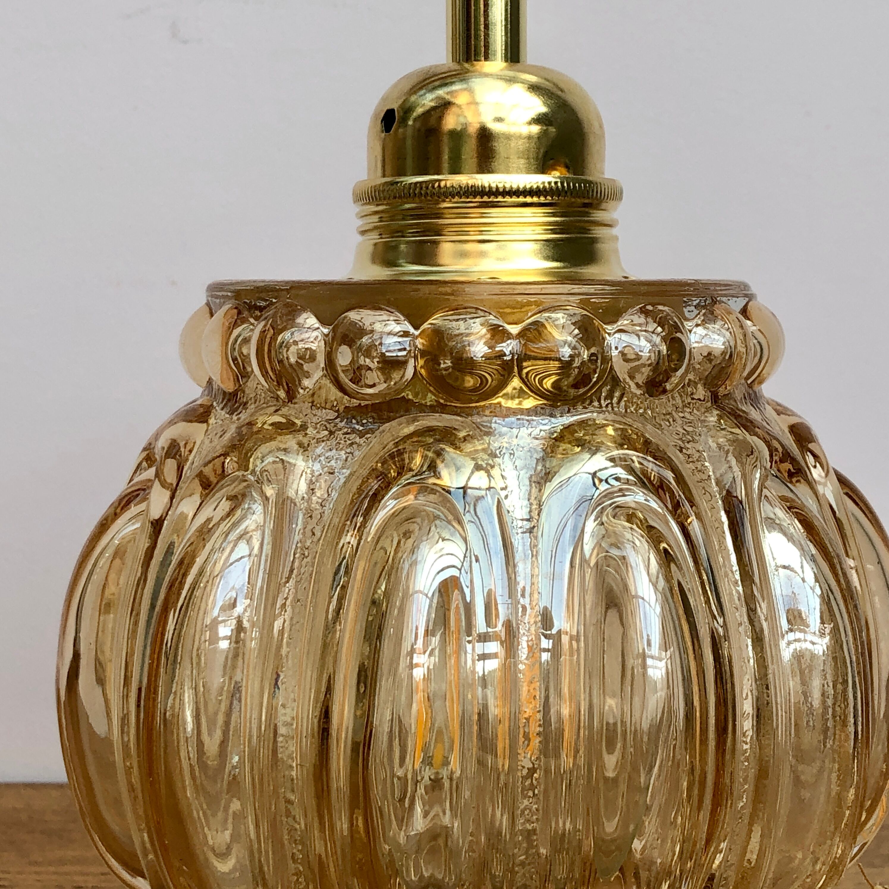 Vintage amber glass globe hand lamp