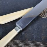 Antique knives with ivory handles.