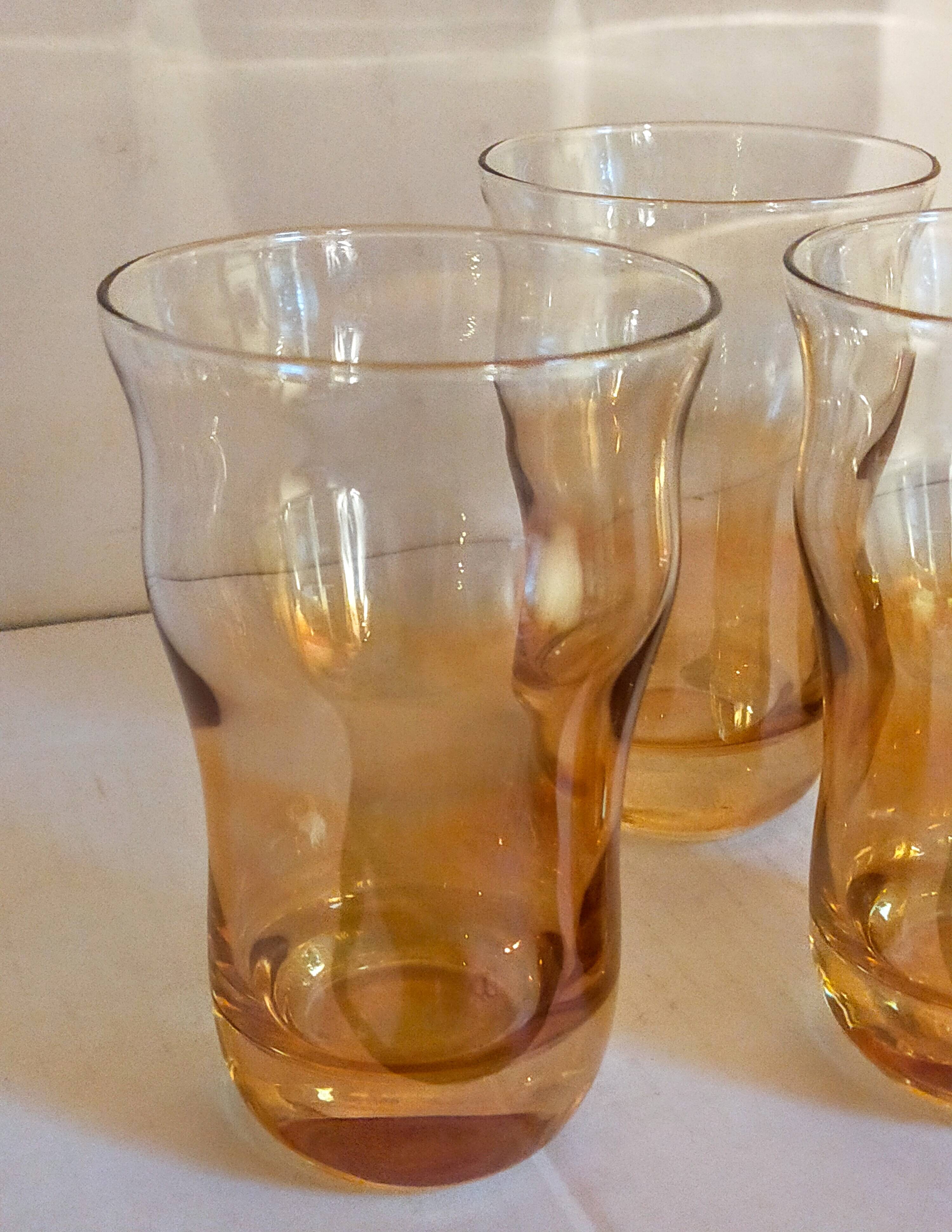 Four iridescent honey blown glass glasses